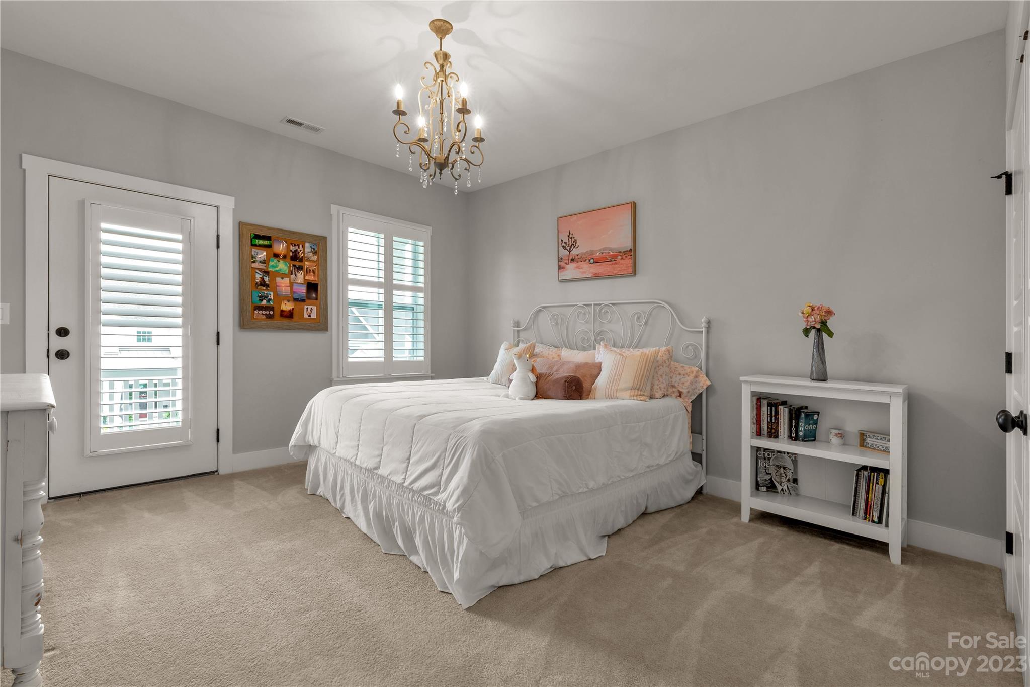844 Bee Balm Trail Fort Mill, SC 29708 - Photo 33 of 48 a spacious bedroom with a bed and a chandelier