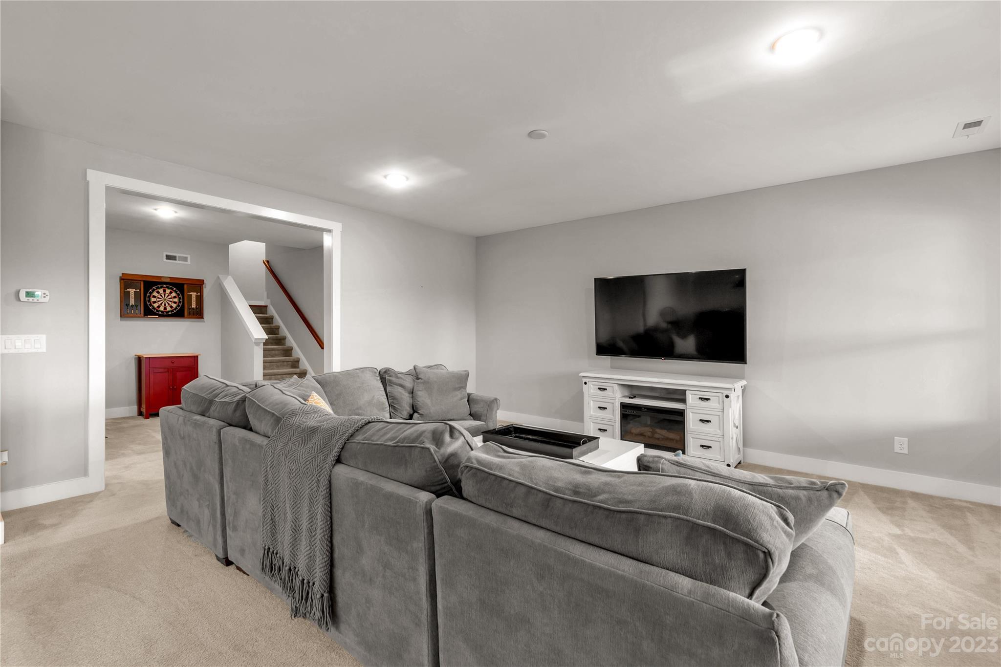 844 Bee Balm Trail Fort Mill, SC 29708 - Photo 37 of 48 a living room with furniture and a flat screen tv