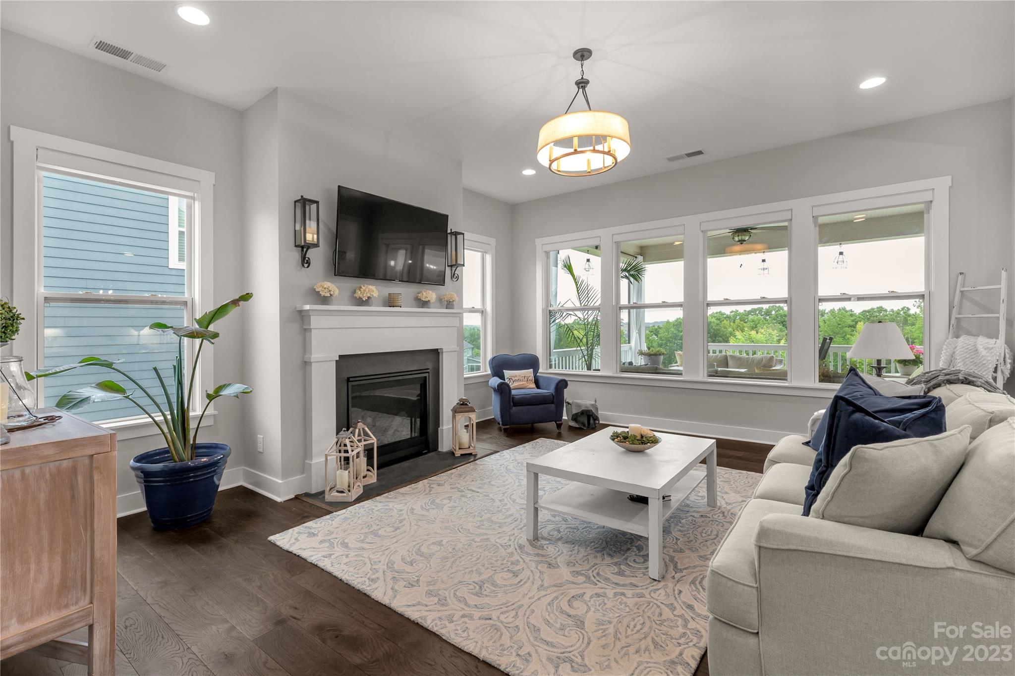 844 Bee Balm Trail Fort Mill, SC 29708 - Photo 8 of 48 a living room with furniture fireplace and a large window