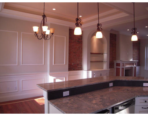 a view of a room with a chandelier furniture and windows