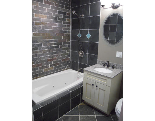 297 K Street, Unit 1 Boston, MA 02127 - Photo 12 of 25 a bathroom with a sink toilet and shower