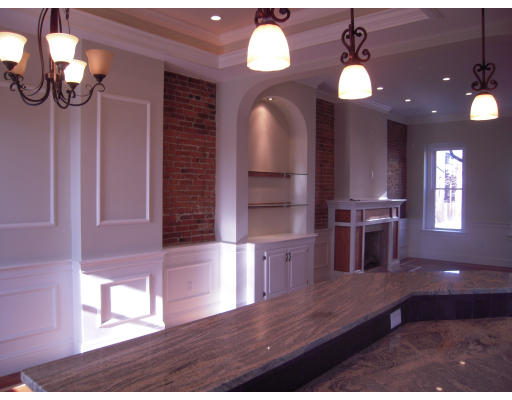 297 K Street, Unit 1 Boston, MA 02127 - Photo 2 of 25 a view of a living room and kitchen with wooden floor