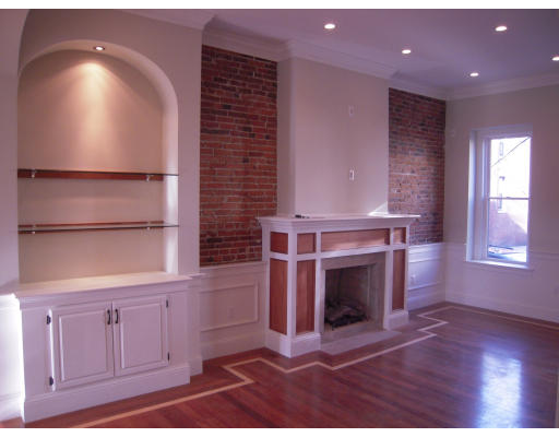 297 K Street, Unit 1 Boston, MA 02127 - Photo 5 of 25 a living room with furniture and a fireplace
