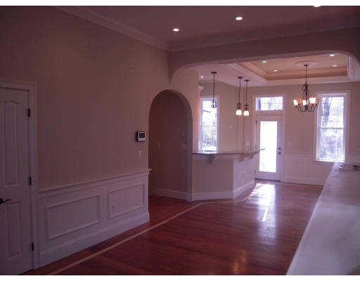 297 K Street, Unit 1 Boston, MA 02127 - Photo 7 of 25 a view of empty room with wooden floor and fan