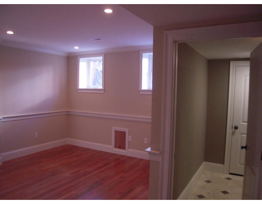 297 K Street, Unit 1 Boston, MA 02127 - Photo 9 of 25 a view of an empty room with wooden floor and a window