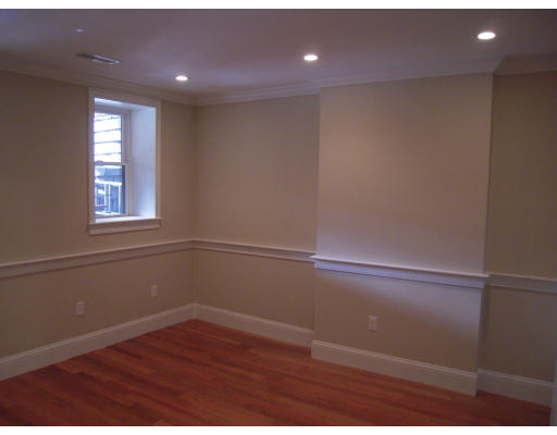297 K Street, Unit 1 Boston, MA 02127 - Photo 10 of 25 a view of empty room with wooden floor and fan