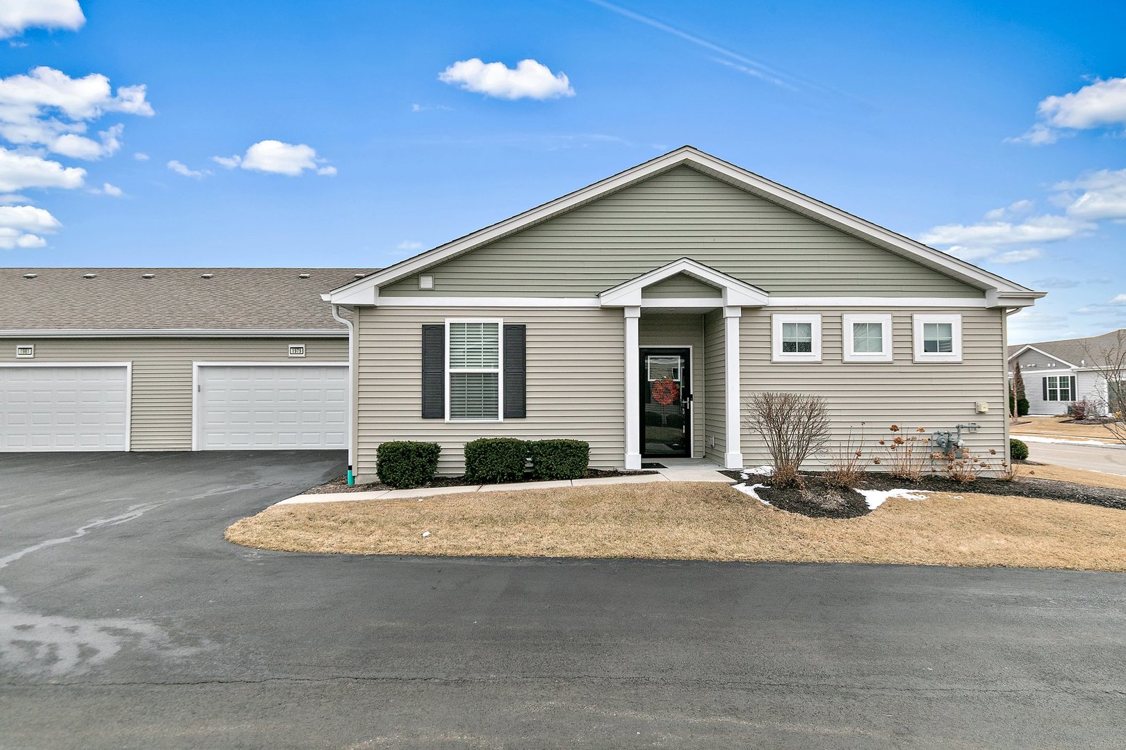 1979 Southern Circle, Unit 1979 Pingree Grove, IL 60140 - Photo 1 of 22 a front view of a house with a yard