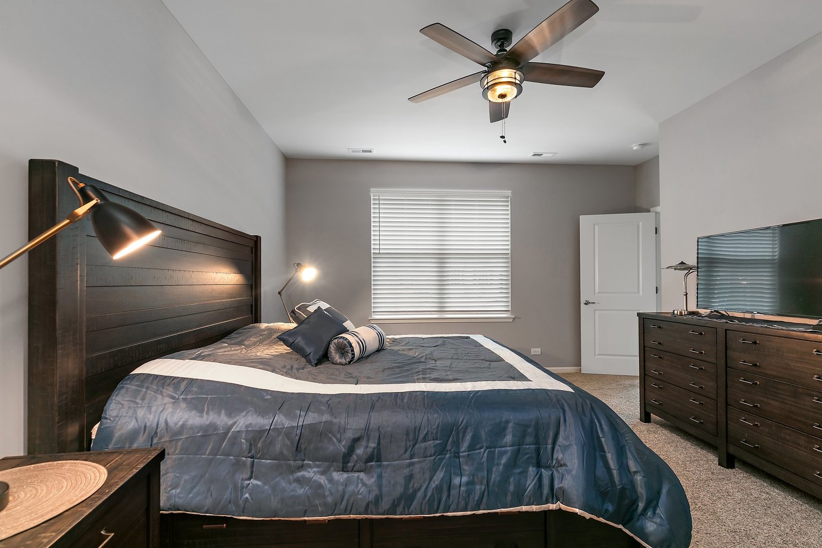 1979 Southern Circle, Unit 1979 Pingree Grove, IL 60140 - Photo 16 of 22 a bedroom with a bed and a flat screen tv