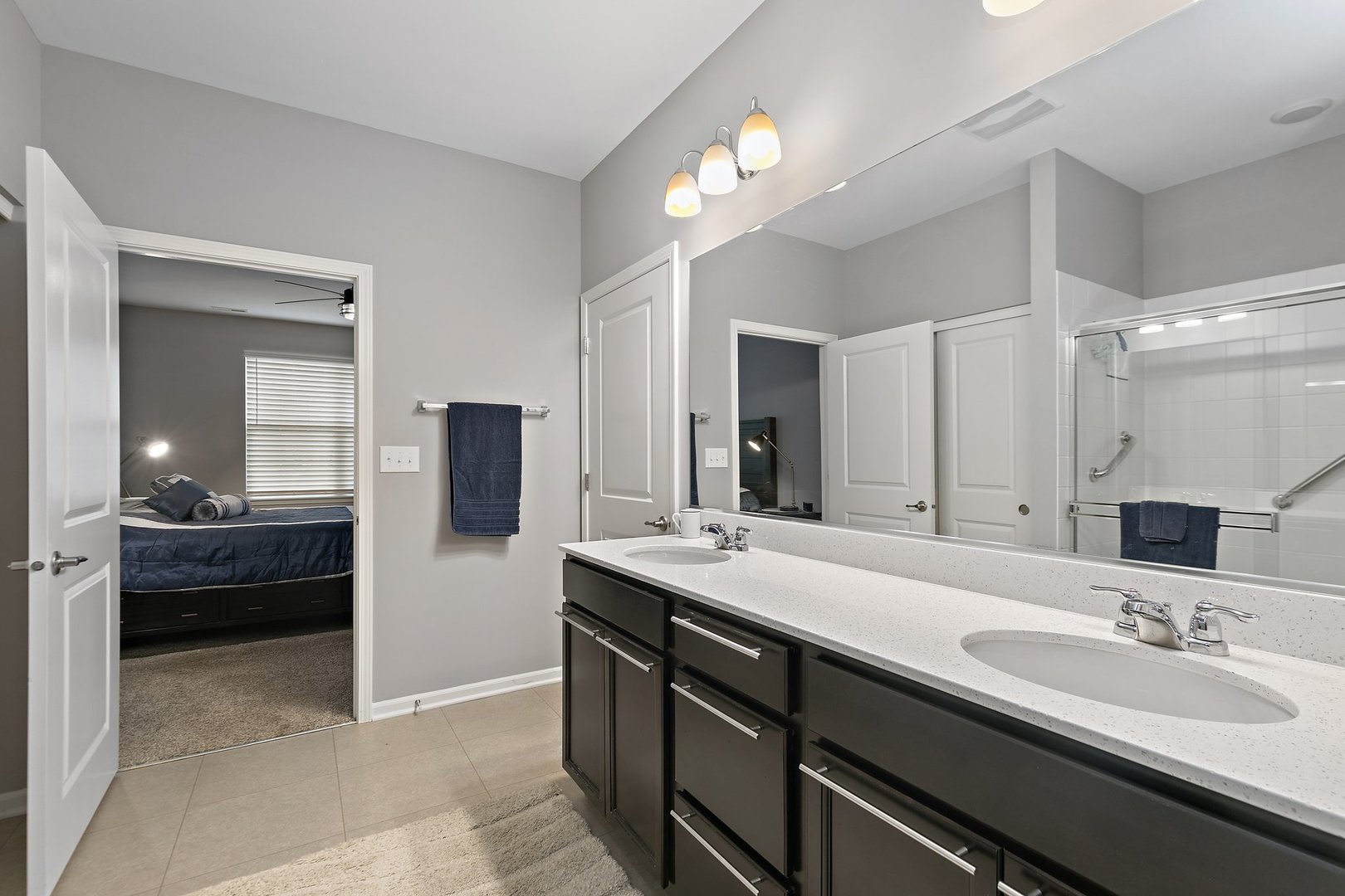 1979 Southern Circle, Unit 1979 Pingree Grove, IL 60140 - Photo 18 of 22 a en suite bathroom with a sink and a mirror