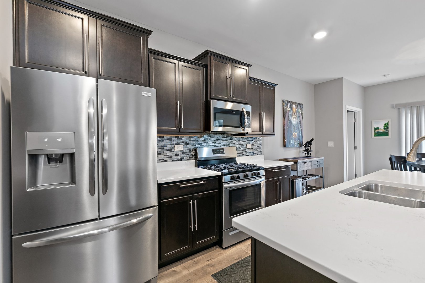 1979 Southern Circle, Unit 1979 Pingree Grove, IL 60140 - Photo 9 of 22 a kitchen with stainless steel appliances and refrigerator