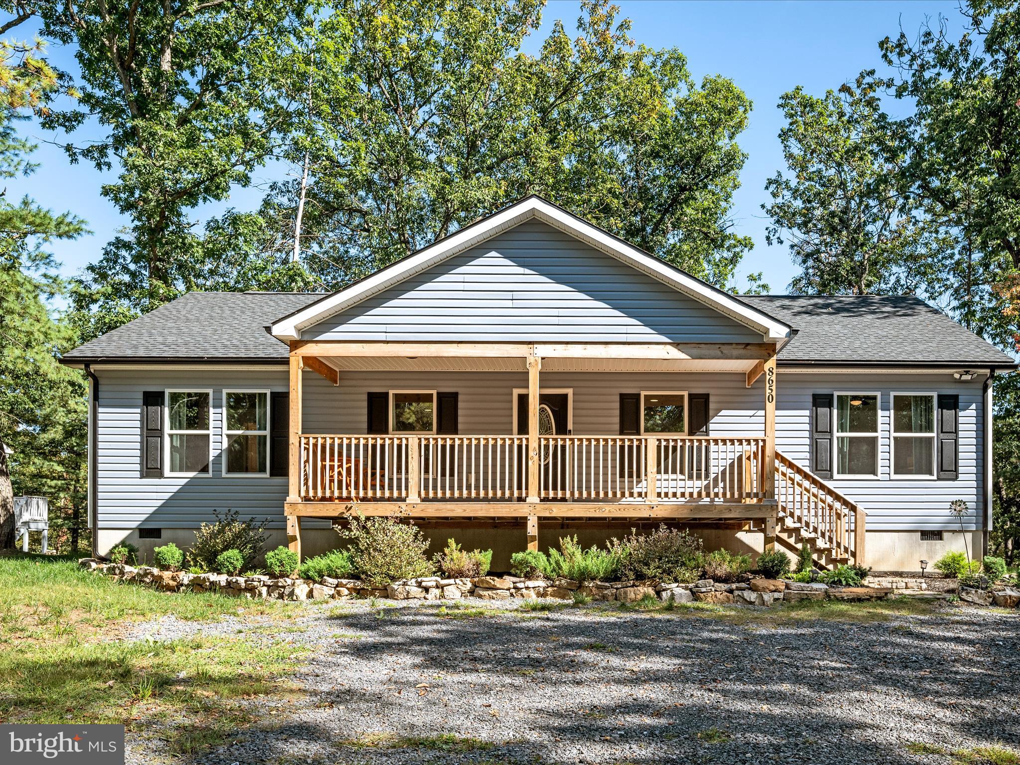8650 Supinlick Ridge Road Mount Jackson, VA 22842 - Photo 1 of 62 a front view of a house with a yard