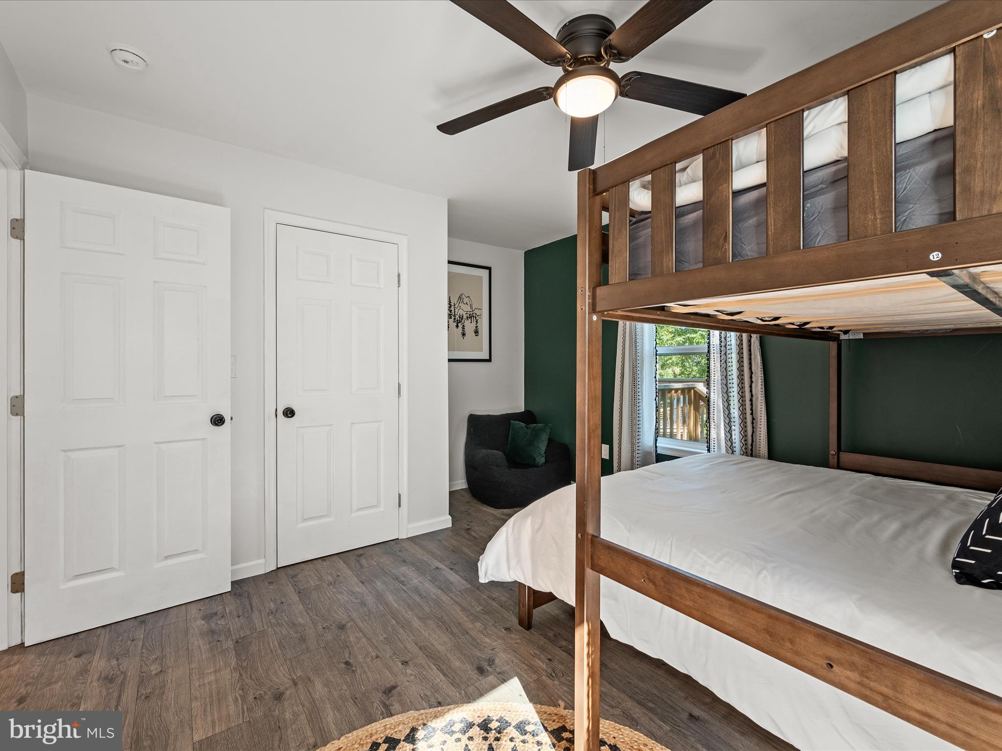8650 Supinlick Ridge Road Mount Jackson, VA 22842 - Photo 25 of 62 a bedroom with a bed and a chandelier