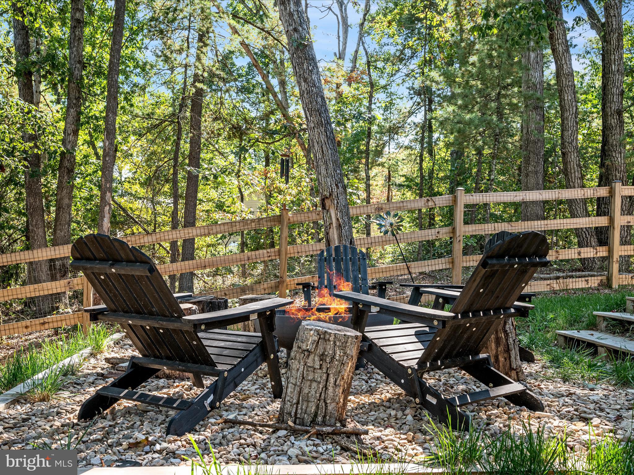 8650 Supinlick Ridge Road Mount Jackson, VA 22842 - Photo 34 of 62 a backyard of a house with table and chairs