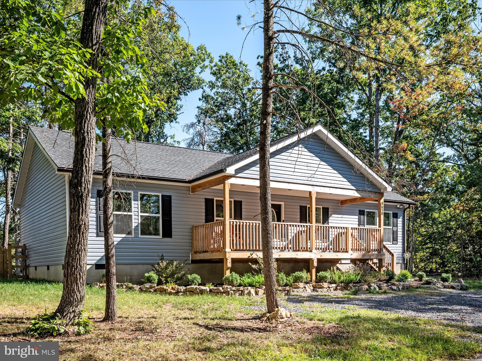 8650 Supinlick Ridge Road Mount Jackson, VA 22842 - Photo 38 of 62 a house with trees in the background