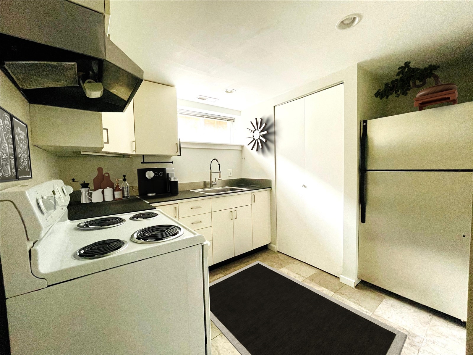 7513 South Sunnycrest Road Seattle, WA 98178 - Photo 11 of 16 a kitchen with a refrigerator a stove and a microwave