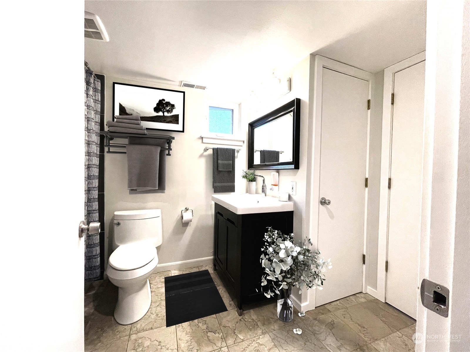 7513 South Sunnycrest Road Seattle, WA 98178 - Photo 14 of 16 a bathroom with a toilet sink and mirror
