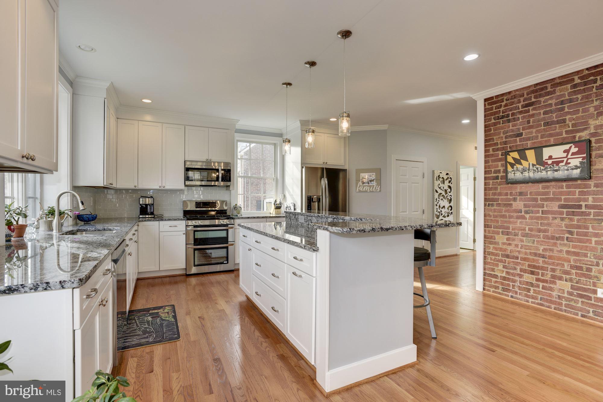 803 Kingston Road Baltimore, MD 21212 - Photo 6 of 51 Exposed brick wall. Quartz counters