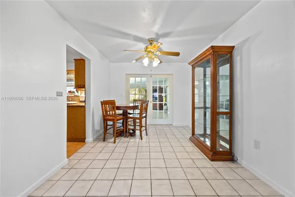 a view of a dining room with furniture window and outside view