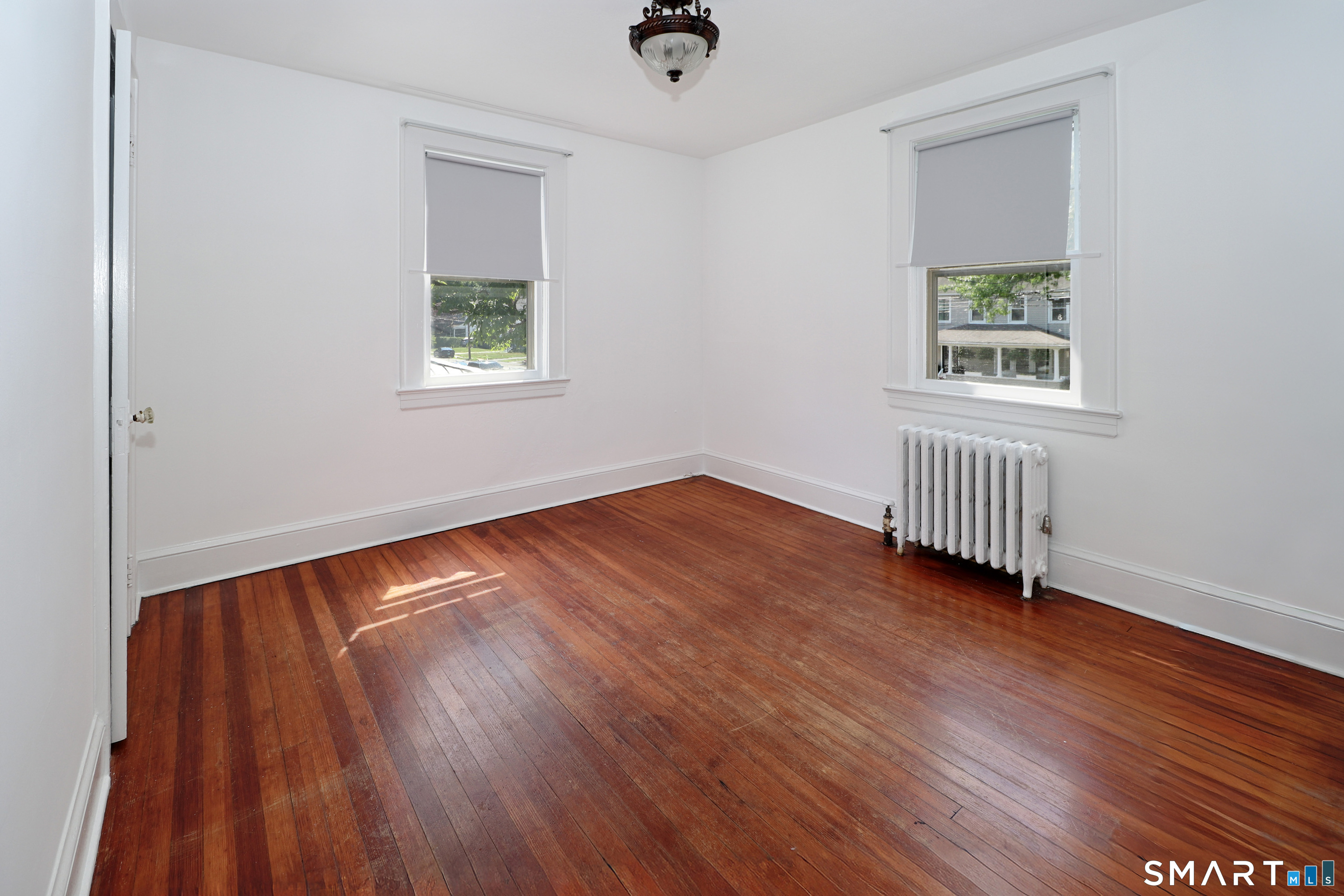 104 Henderson Road Fairfield, CT 06824 - Photo 18 of 26 Upper Level 2nd Bedroom with Softwood Floor