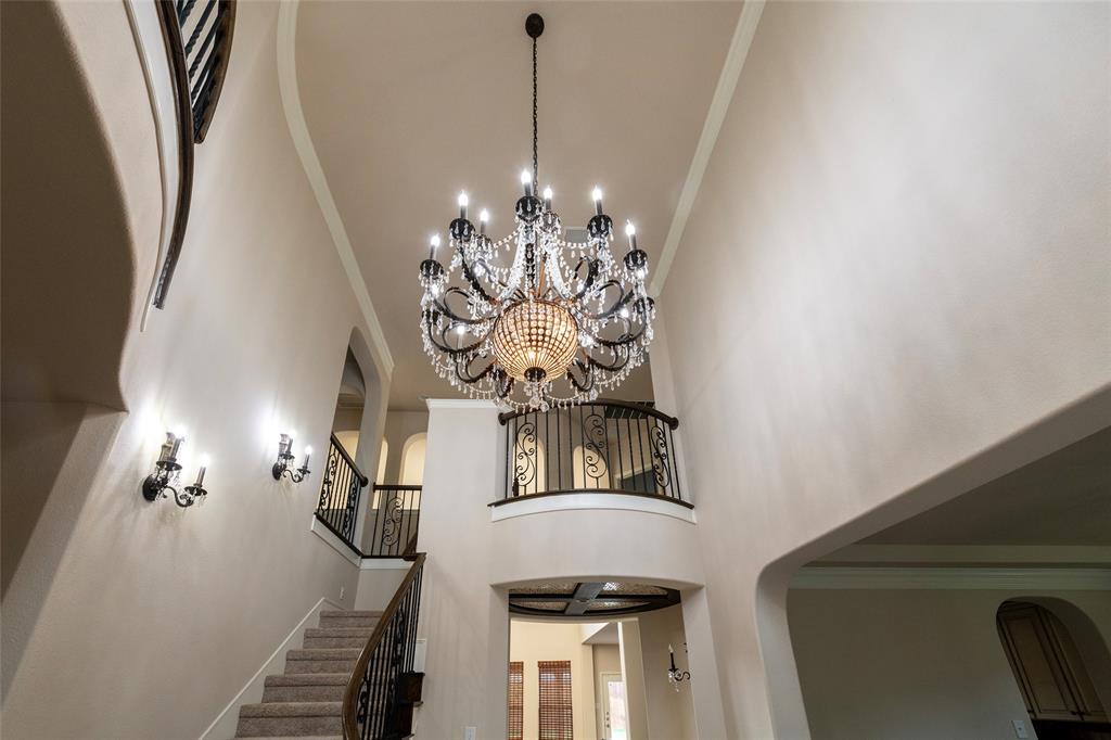 12571 Valley Spring Drive Frisco, TX 75035 - Photo 3 of 39 a view of a livingroom with furniture and chandelier