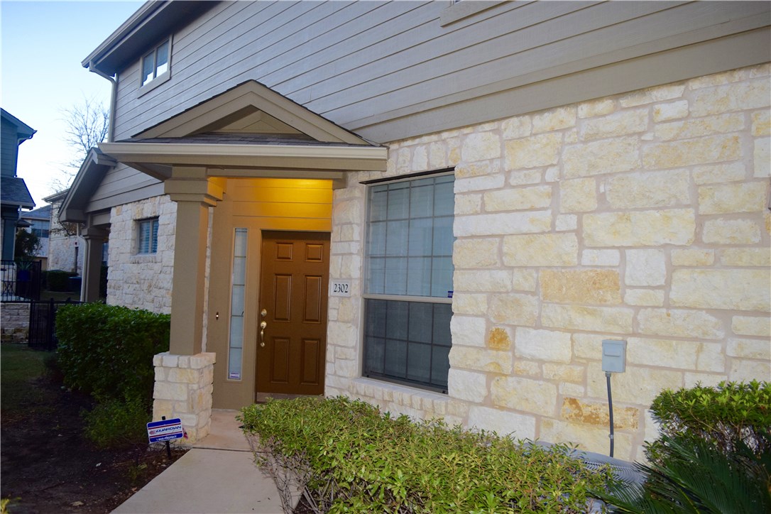 14815 Avery Ranch Boulevard, Unit 2302 Austin, TX 78717 - Photo 1 of 1 a front view of a house with a yard