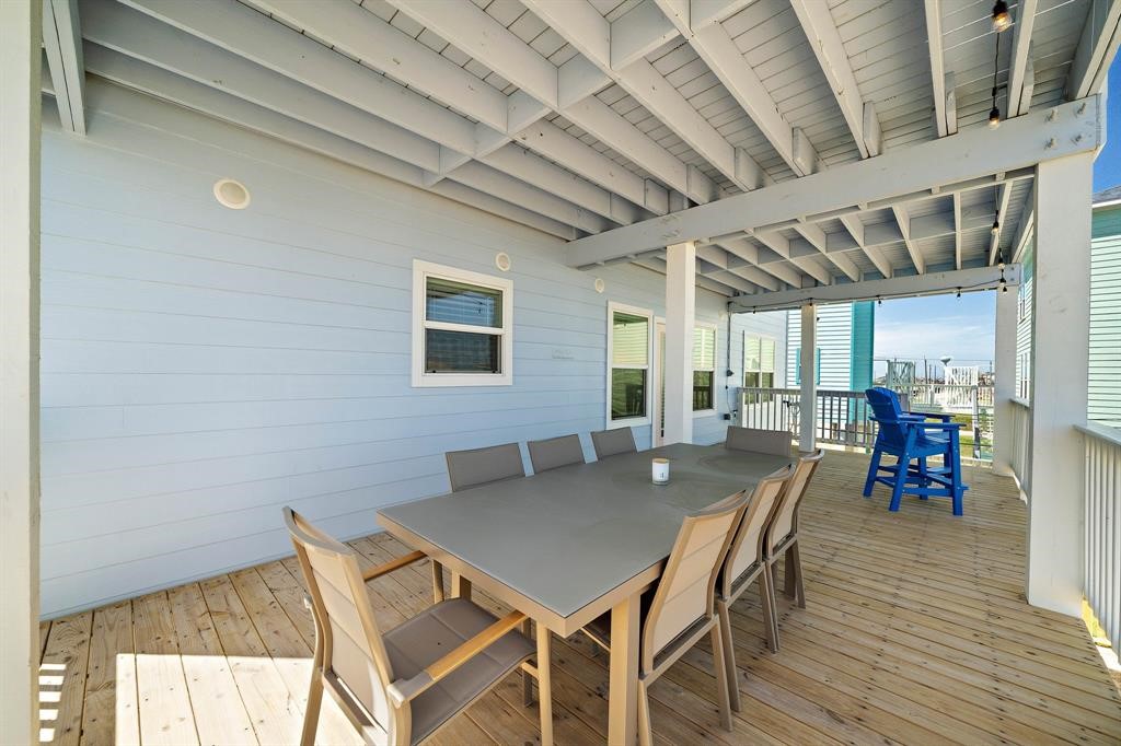 622 Crane Court Surfside Beach, TX 77541 - Photo 15 of 30 a view of a dining room with furniture and wooden floor
