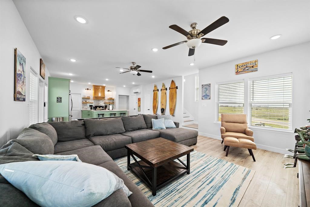 622 Crane Court Surfside Beach, TX 77541 - Photo 20 of 30 a living room with furniture ceiling fan and a rug