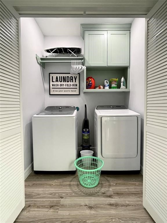622 Crane Court Surfside Beach, TX 77541 - Photo 24 of 30 a utility room with a stove a fridge and a window