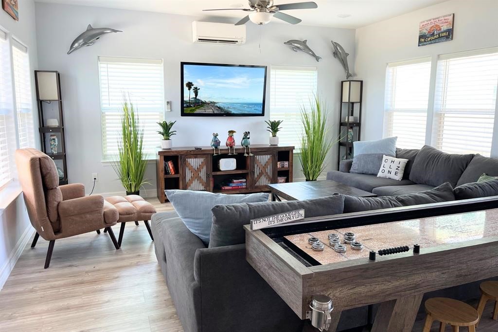 622 Crane Court Surfside Beach, TX 77541 - Photo 3 of 30 a living room with furniture and a flat screen tv