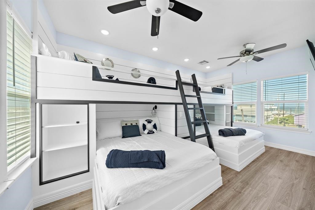 622 Crane Court Surfside Beach, TX 77541 - Photo 7 of 30 a bedroom with furniture and a large window