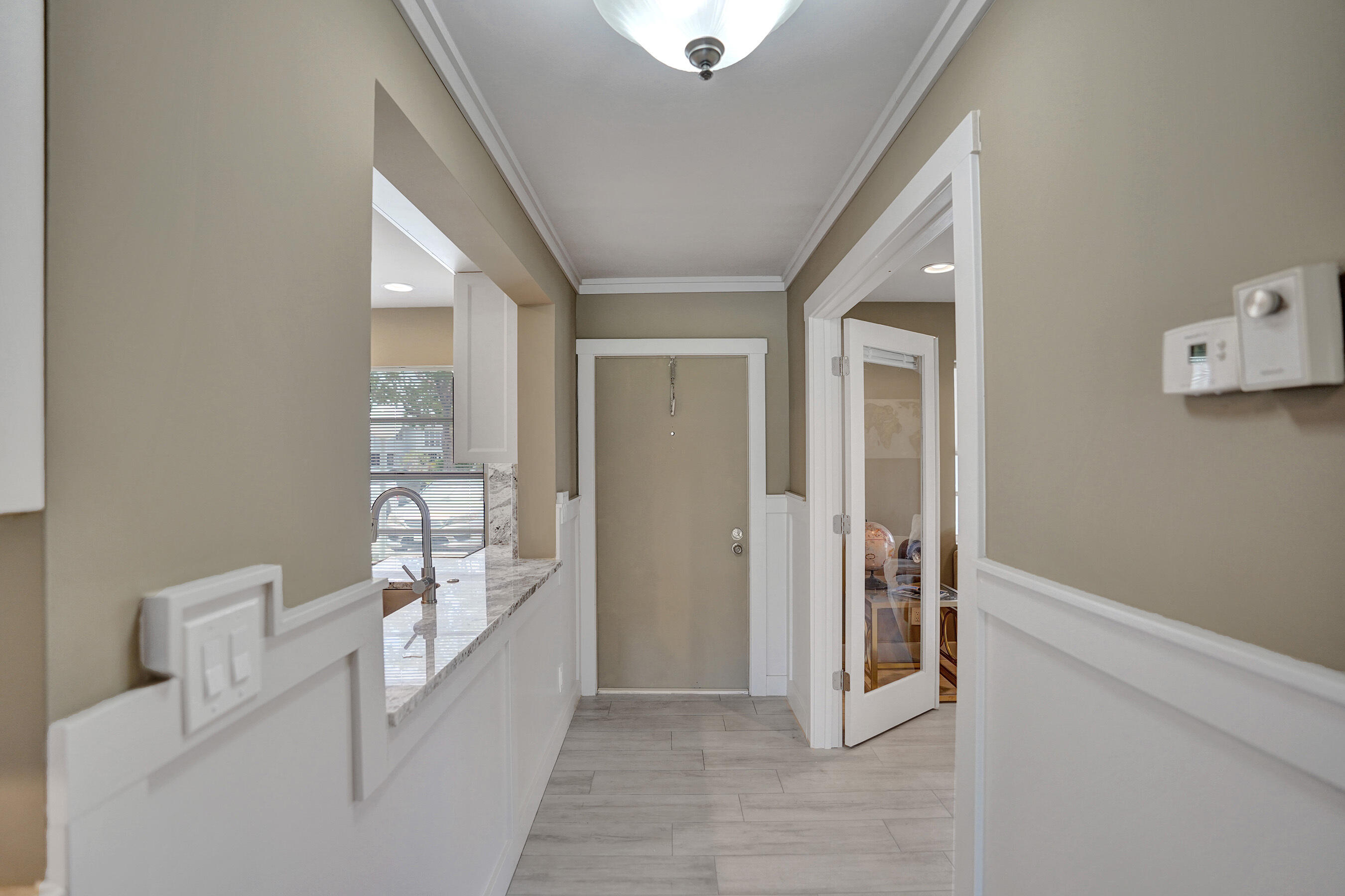 2820 Southwest 13th Street, Unit 101 Delray Beach, FL 33445 - Photo 60 of 83 Hallway to front door