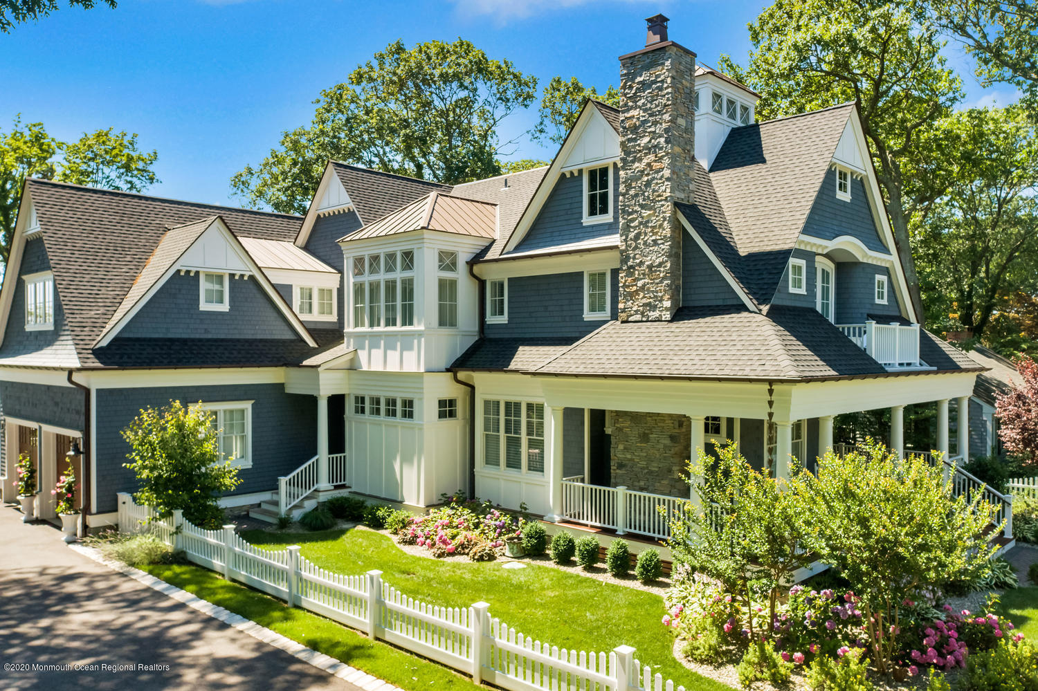 1008 Forrest Road Brielle, NJ 08730 - Photo 2 of 81 a front view of a house with a garden and plants