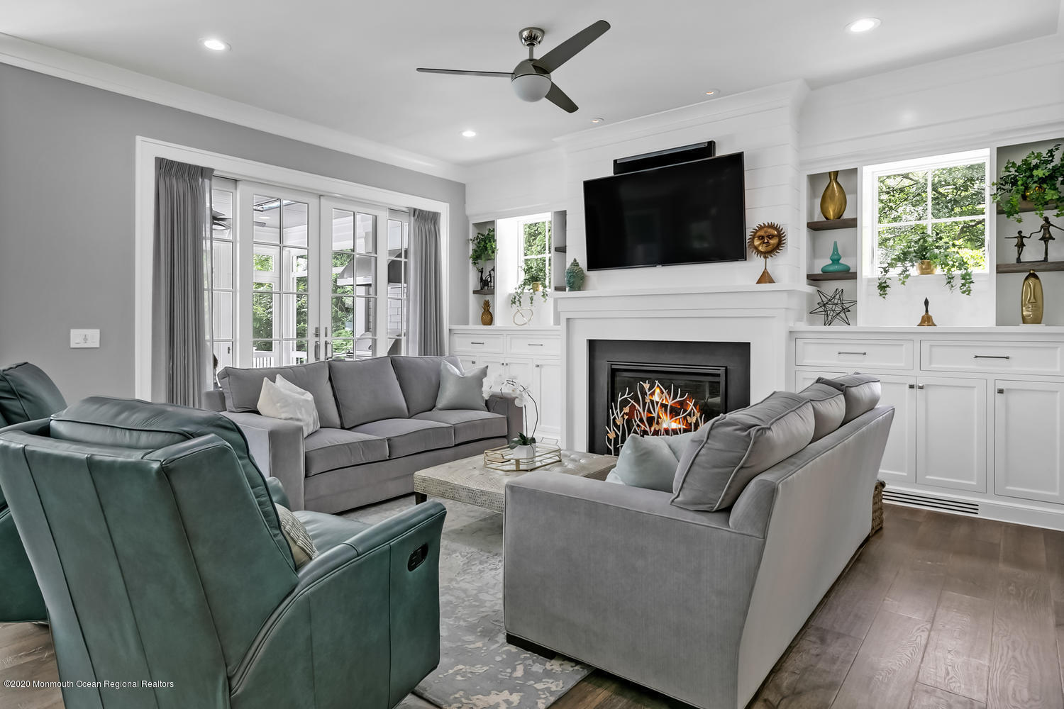 1008 Forrest Road Brielle, NJ 08730 - Photo 12 of 81 a living room with furniture a flat screen tv and a fireplace