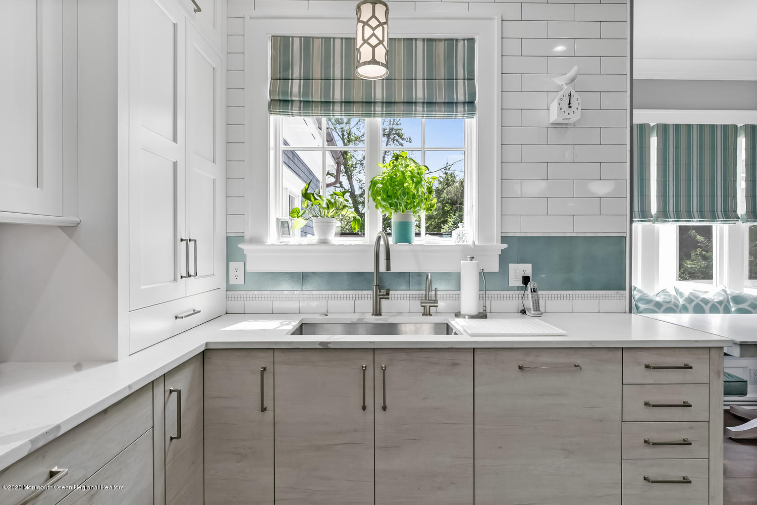 1008 Forrest Road Brielle, NJ 08730 - Photo 18 of 81 a kitchen with a granite countertop sink and white cabinets