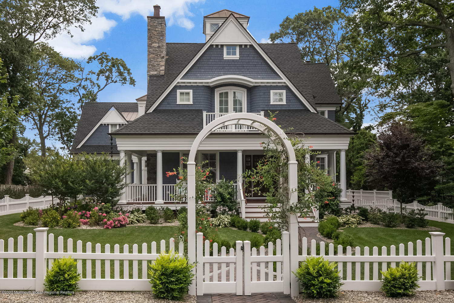 1008 Forrest Road Brielle, NJ 08730 - Photo 3 of 81 a front view of a house with a garden