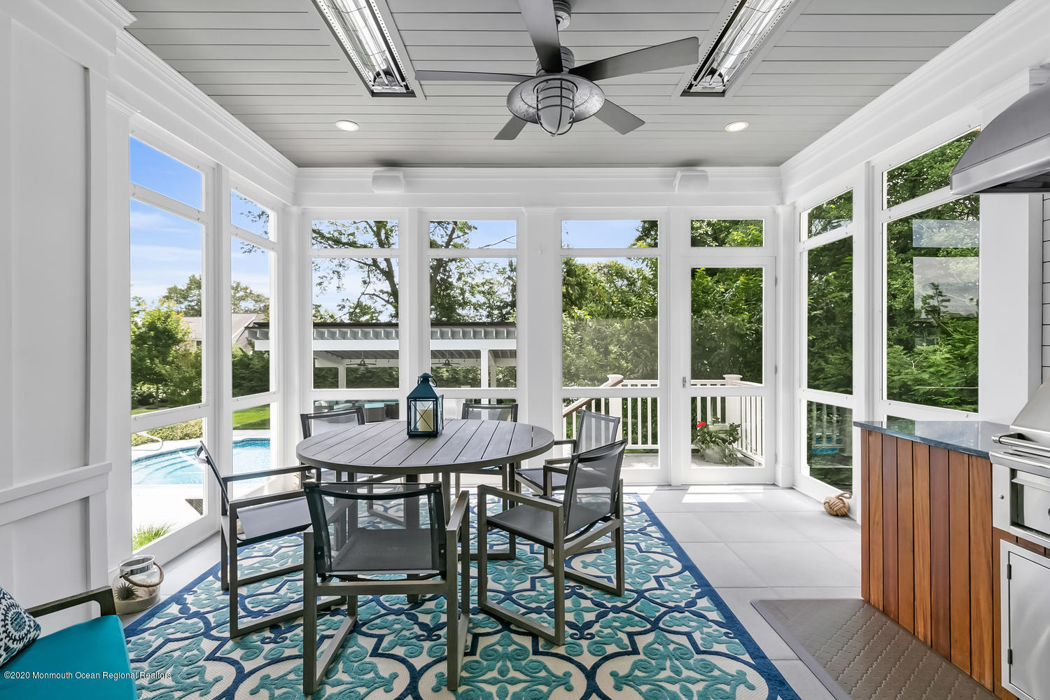 1008 Forrest Road Brielle, NJ 08730 - Photo 26 of 81 a view of a dining room with furniture large windows and wooden floor