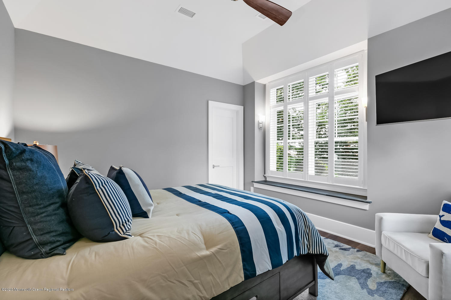 1008 Forrest Road Brielle, NJ 08730 - Photo 30 of 81 a bedroom with a bed and a flat screen tv