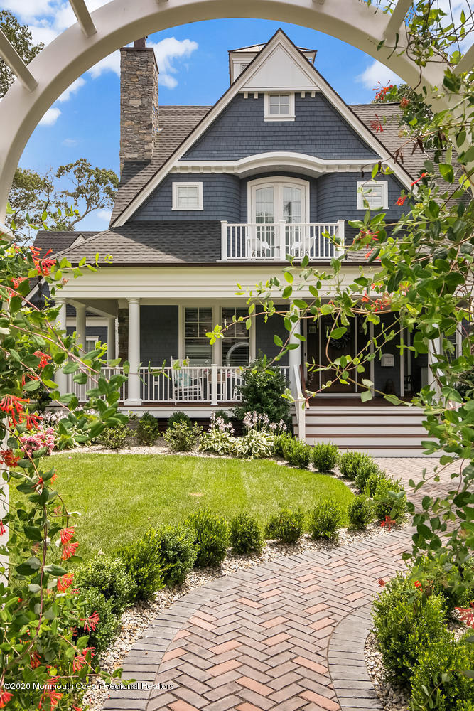 1008 Forrest Road Brielle, NJ 08730 - Photo 4 of 81 a front view of a house with a garden