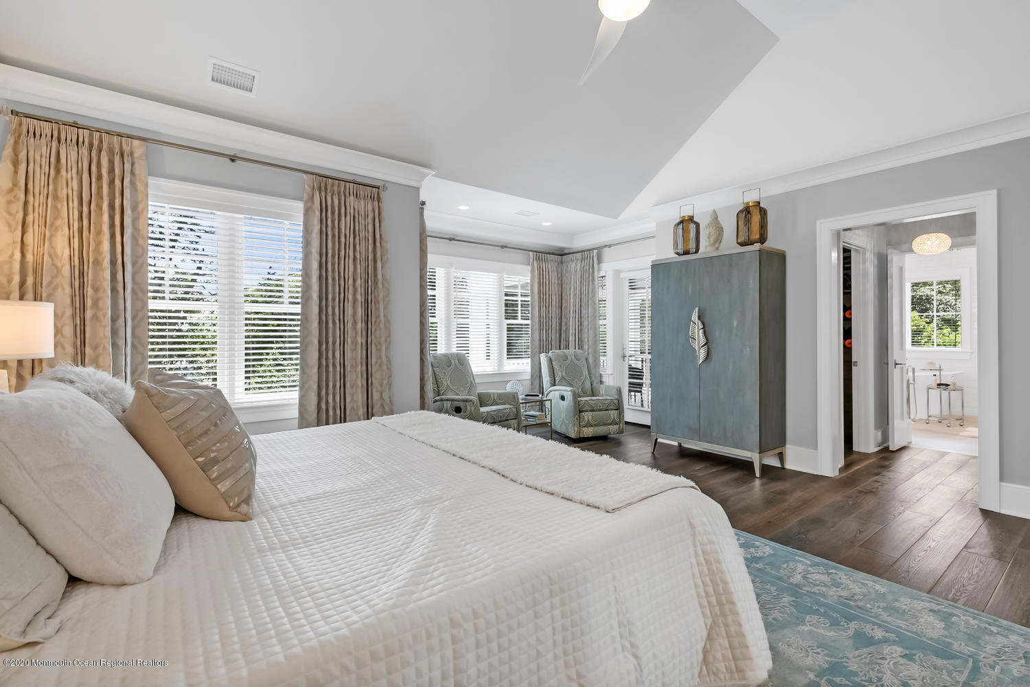 1008 Forrest Road Brielle, NJ 08730 - Photo 38 of 81 a spacious bedroom with a bed a mirror and a large window