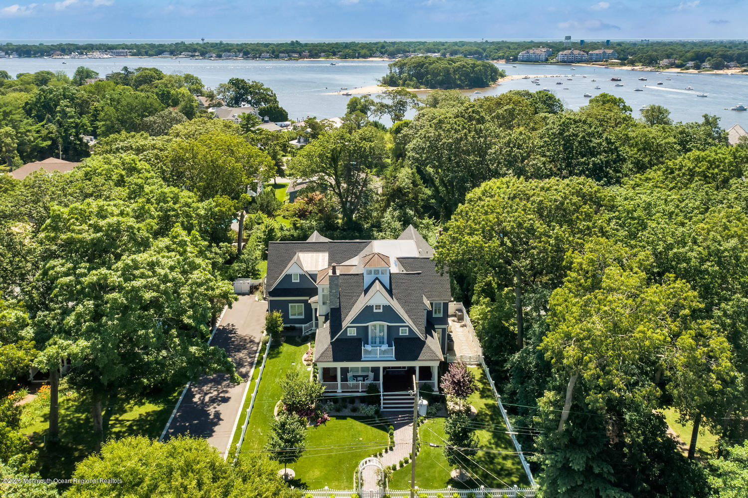 1008 Forrest Road Brielle, NJ 08730 - Photo 66 of 81 an aerial view of a house with a garden and lake view