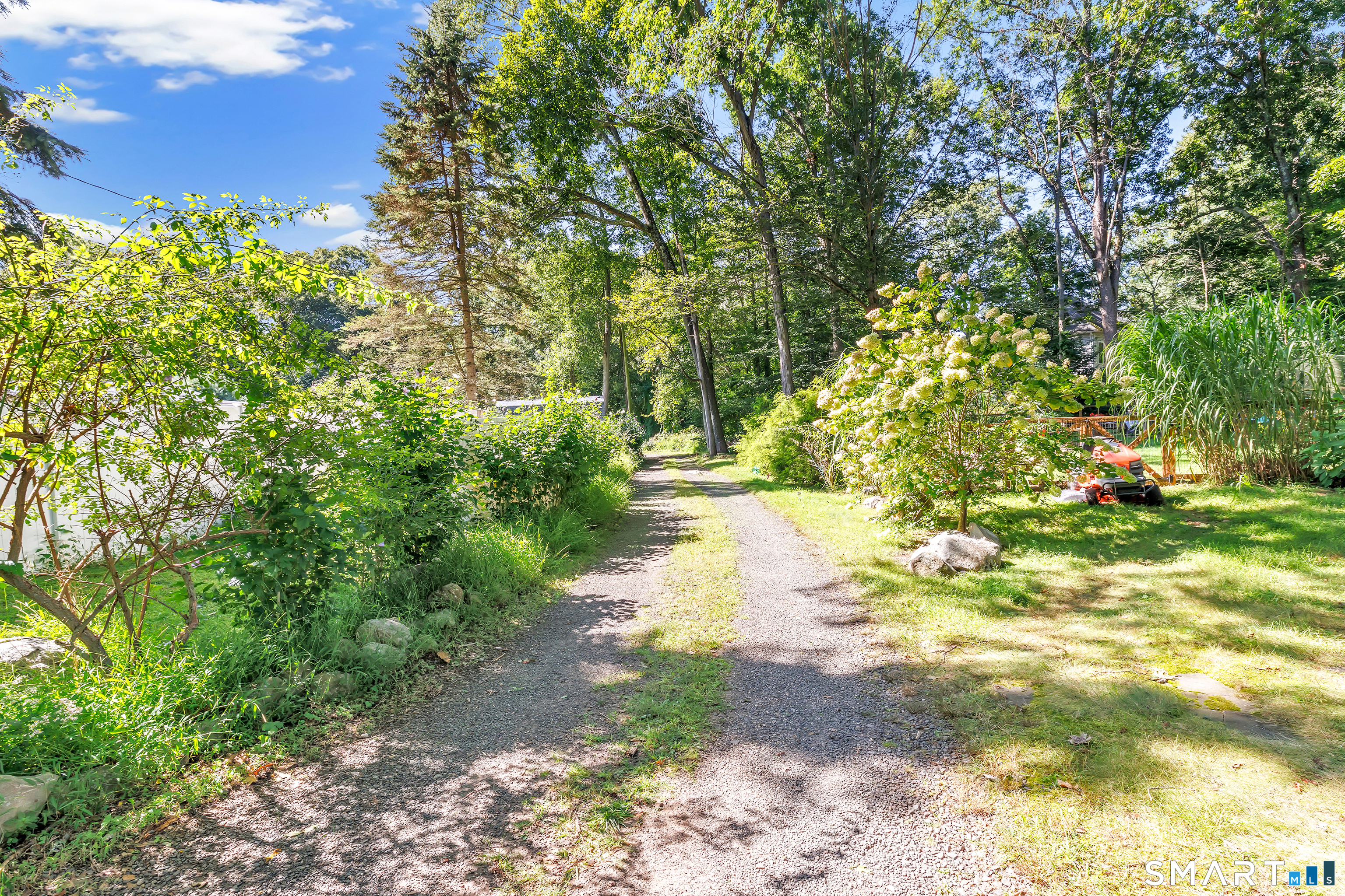 606 North Madison Road Guilford, CT 06437 - Photo 5 of 38 A peaceful, tree-lined approach welcomes you home