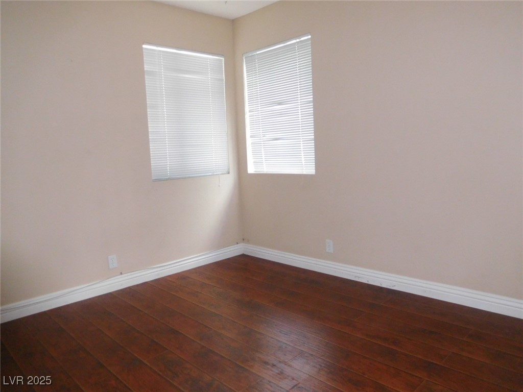 3220 Tocata Drive Las Vegas, NV 89146 - Photo 10 of 12 Empty room featuring dark wood finished floors and