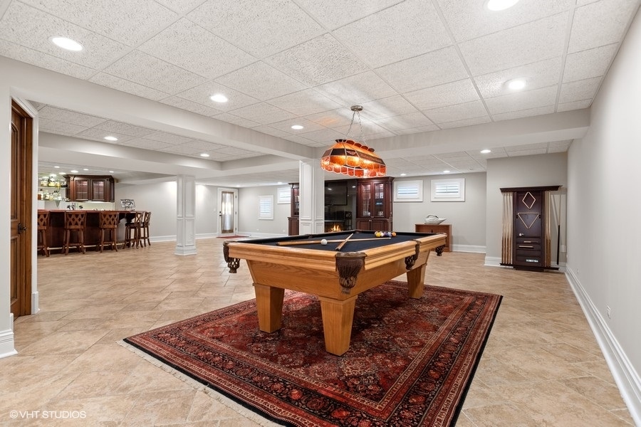 5N695 Dunham Trails Road Wayne, IL 60184 - Photo 22 of 48 a room with furniture a rug and a chandelier