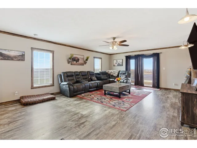 a kitchen with stainless steel appliances kitchen island granite countertop a sink and cabinets