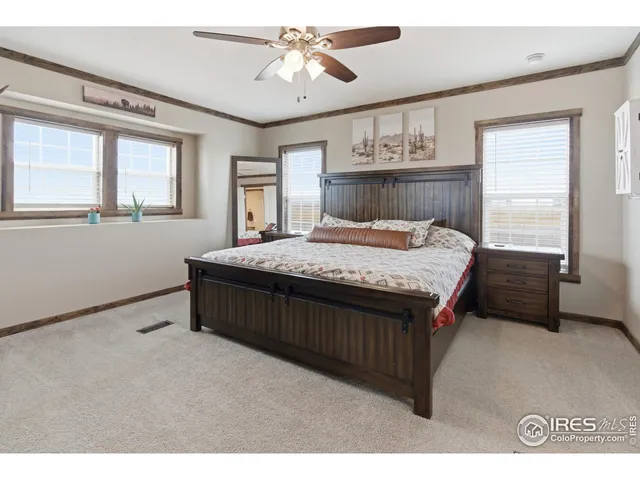 a hallway with a sink and cabinets