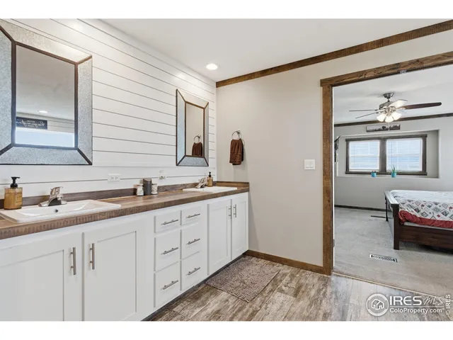 a bedroom with double bed and a large window