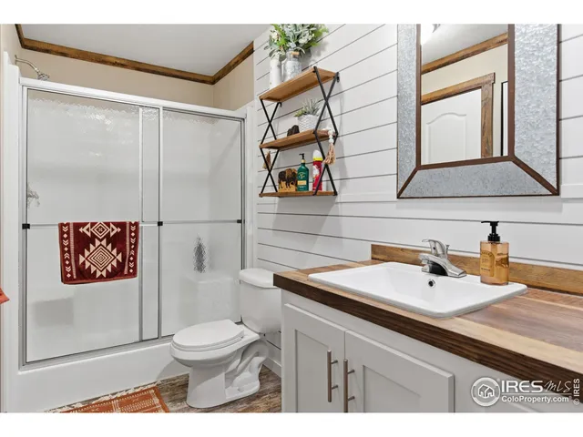 a view of a house with backyard porch and sitting area