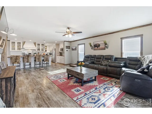 a kitchen with granite countertop a sink stainless steel appliances and cabinets