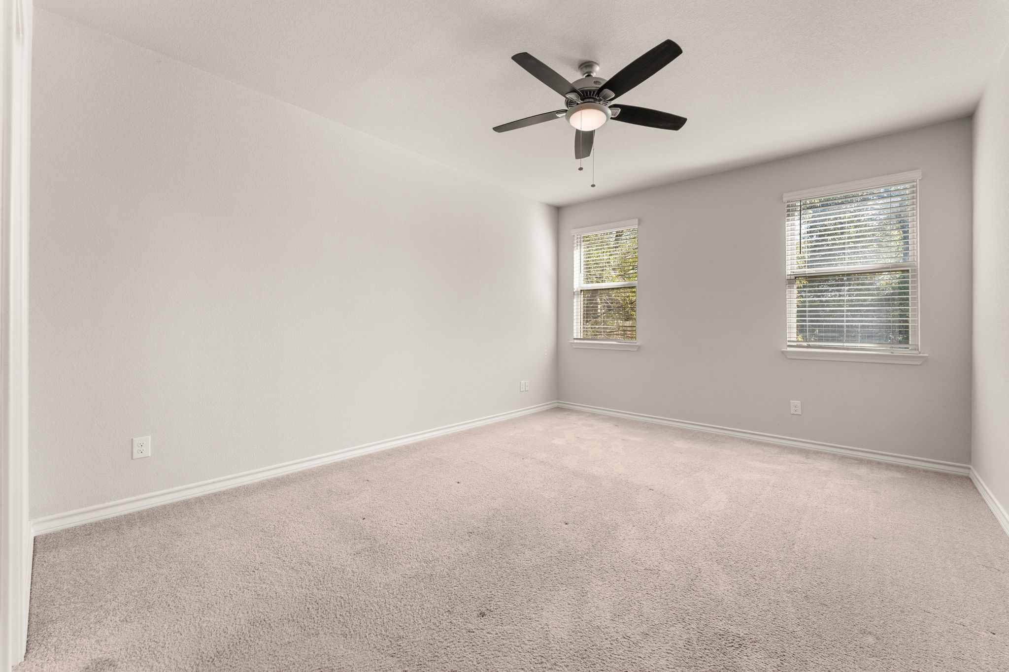 740 Aliso Trail Leander, TX 78641 - Photo 16 of 35 The main-floor primary suite provides a peaceful retreat separate from guest spaces.