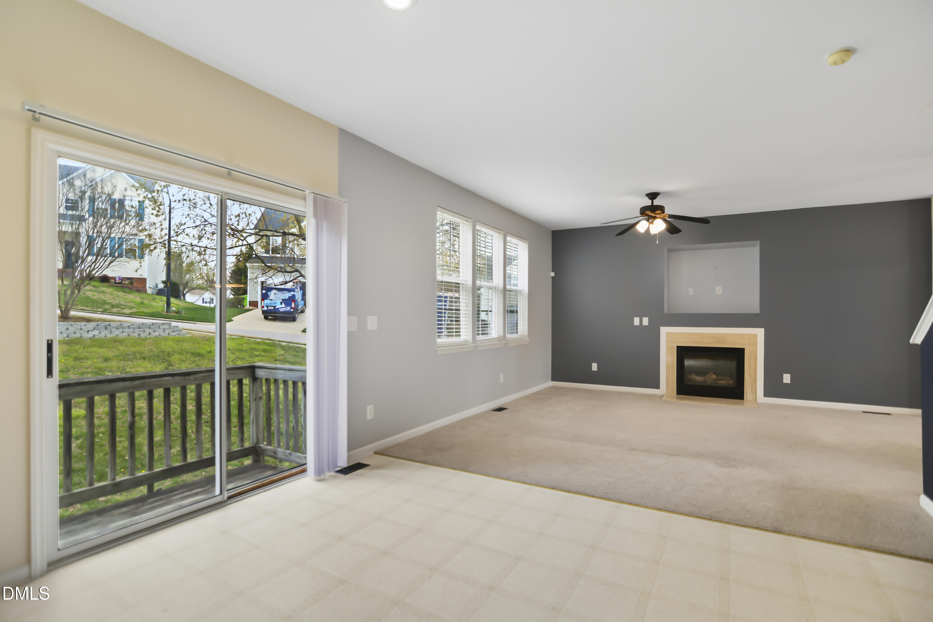2241 Spruce Shadows Lane Raleigh, NC 27614 - Photo 9 of 29 a view of a livingroom with an empty space and a fireplace